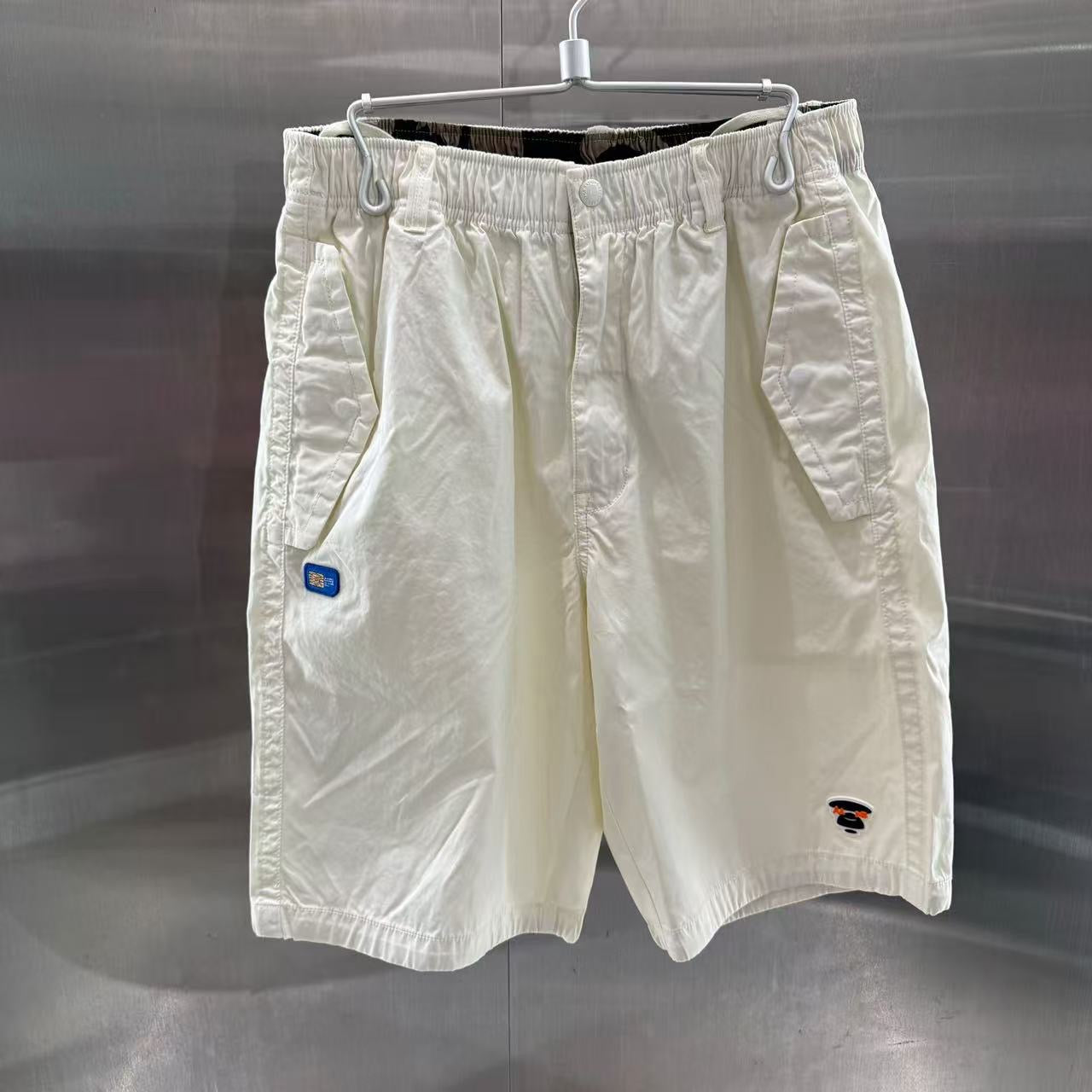 香港代購 專櫃正品 26春夏 Aape 男 AAPEUNVS 猿人徽章水洗做舊潮流迷彩工裝短褲D614